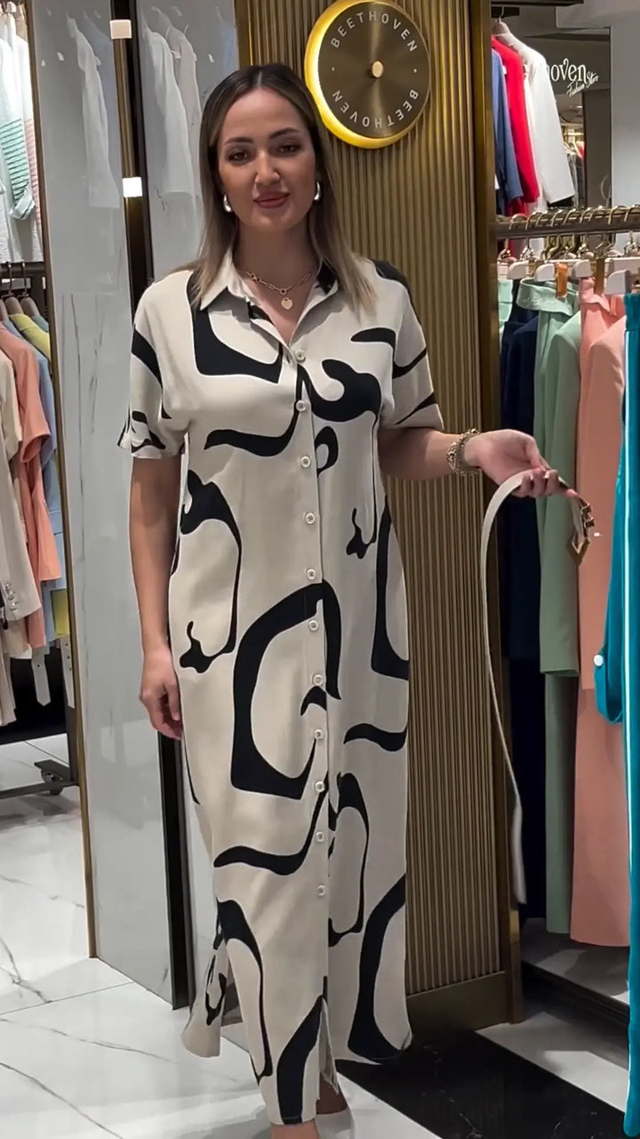 Jolira | Elegantes tailliertes Kleid mit unregelmäßigem Muster