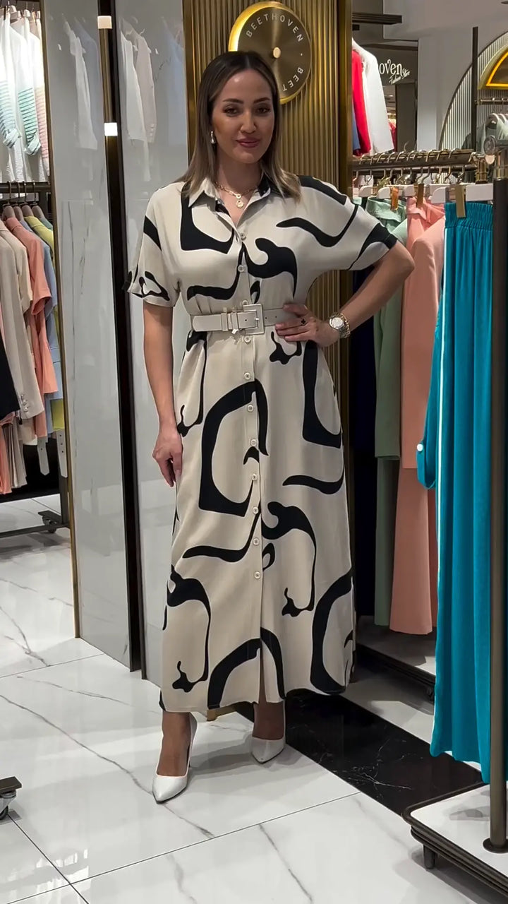 Jolira | Elegantes tailliertes Kleid mit unregelmäßigem Muster