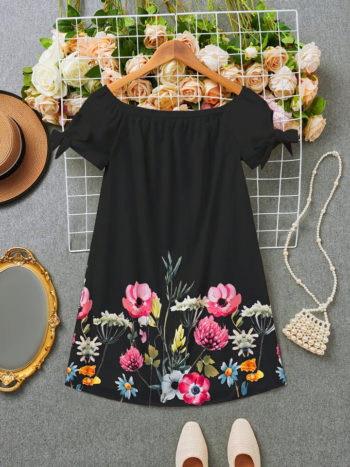 Viviana | Ein Kleid mit Blumenmuster und Schleifendekoration