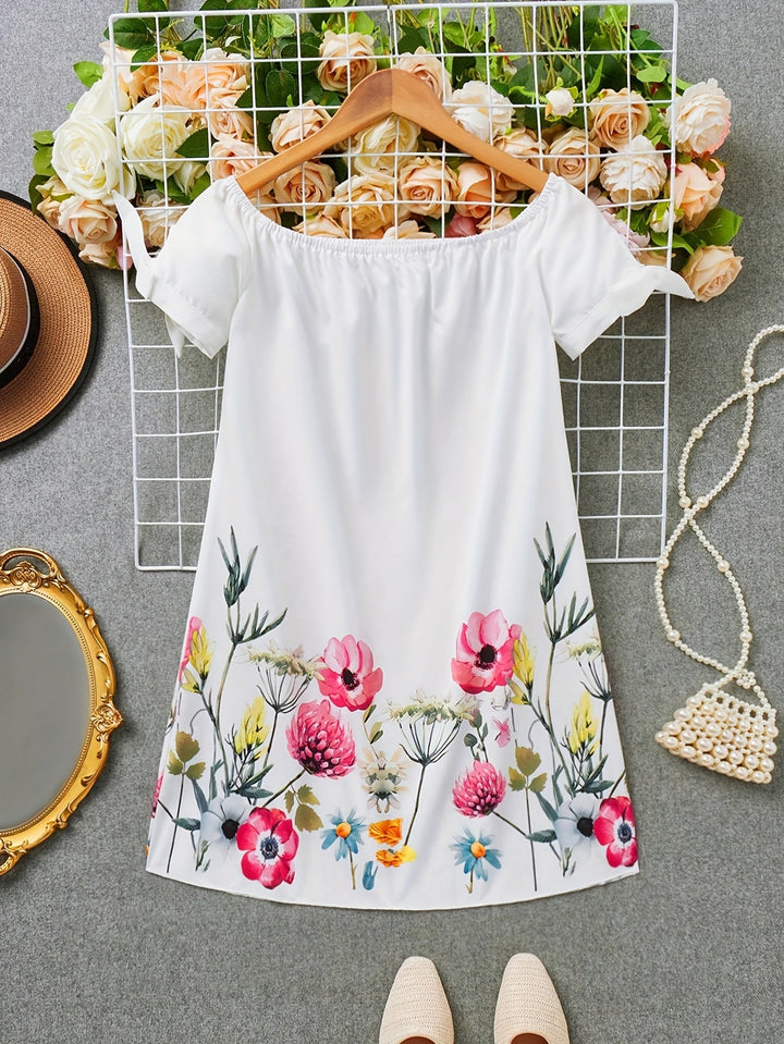 Viviana | Ein Kleid mit Blumenmuster und Schleifendekoration
