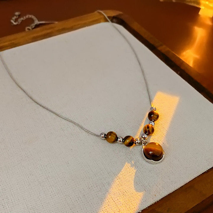 Lucia | Tigerauge Halskette mit Rundanhänger und zeitloser Eleganz