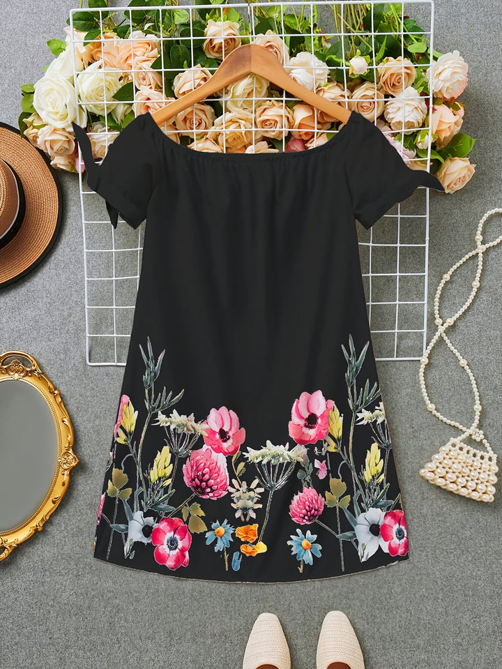 Viviana | Ein Kleid mit Blumenmuster und Schleifendekoration